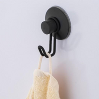 Slim matte black wall hook with a rounded minimalist profile