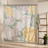 Bold yellow daisies and citrus slices among sage leaves on white