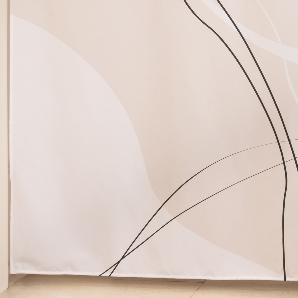 Full length ecru line art curtain hanging beside a glass screen