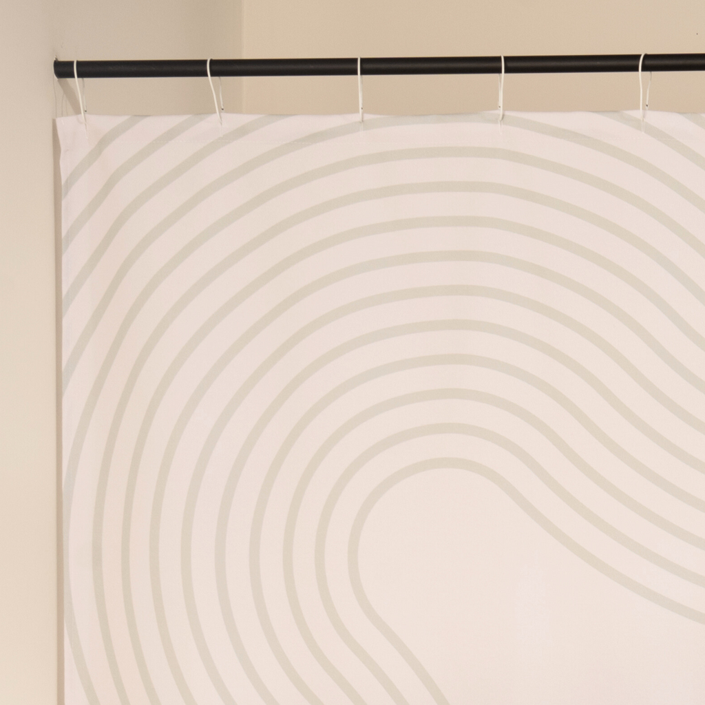 Close detail of the cream arcs on the ivory woven ground