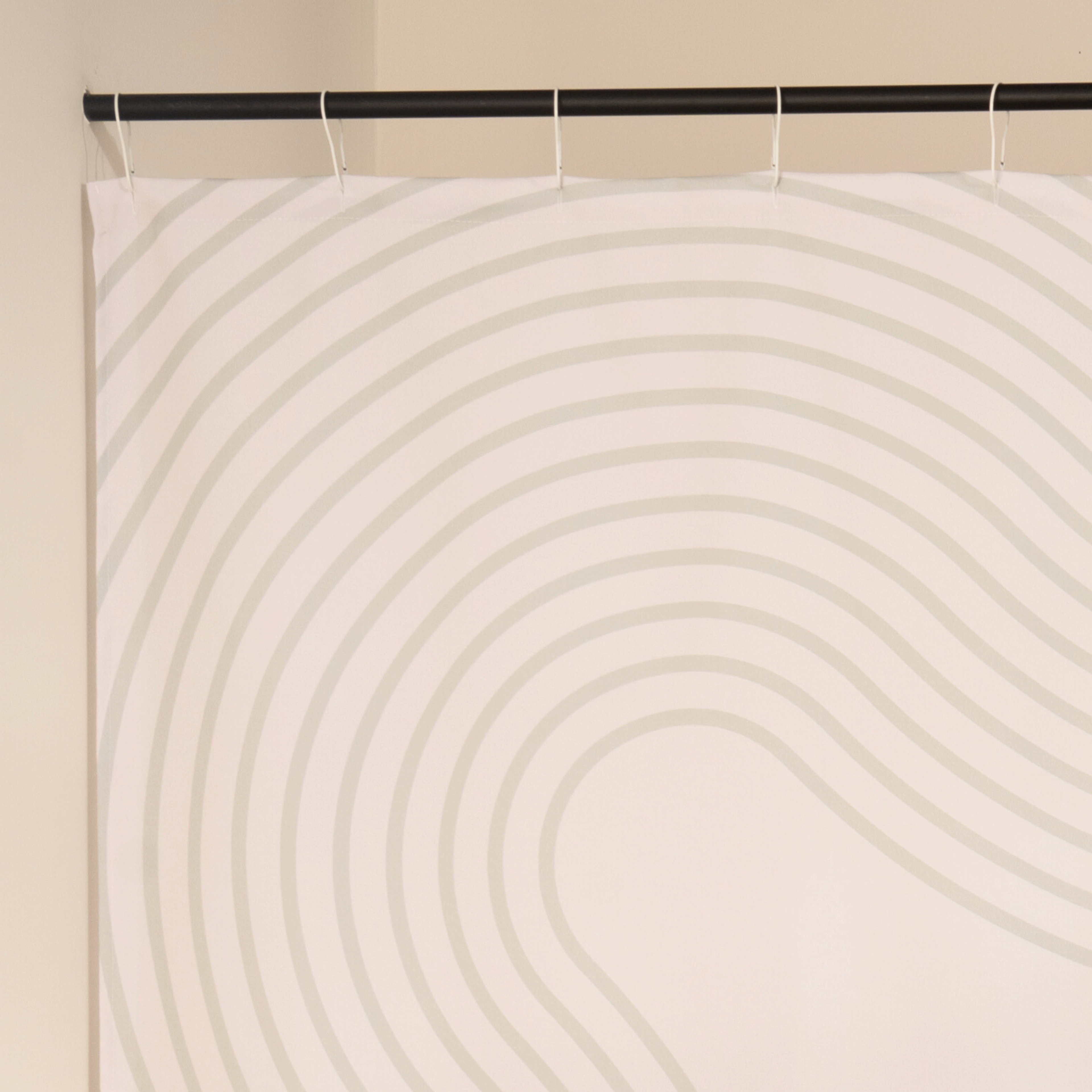 Close detail of the cream arcs on the ivory woven ground