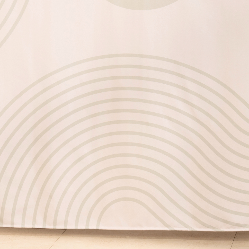 Full length ivory arc curtain hanging in a long even drop