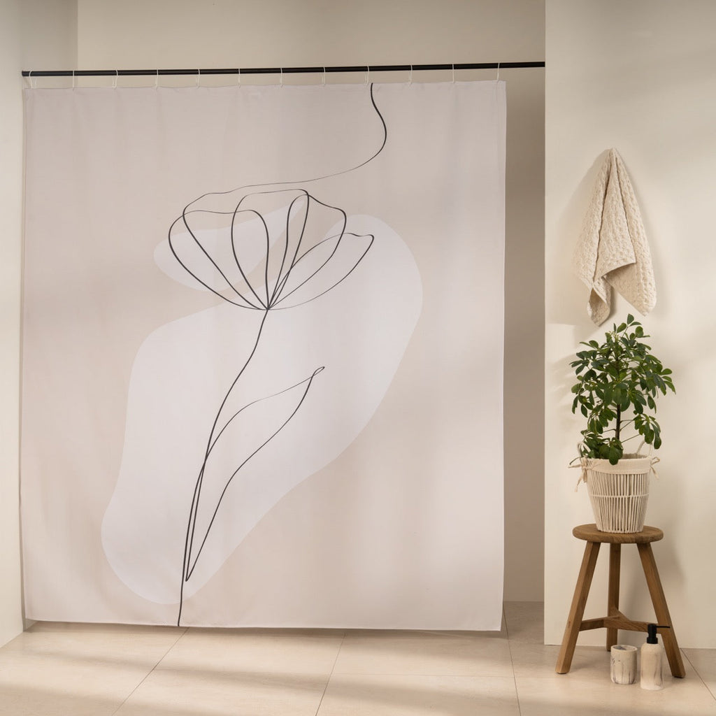 Tulip drawn in one continuous black line over a cream shape on greige