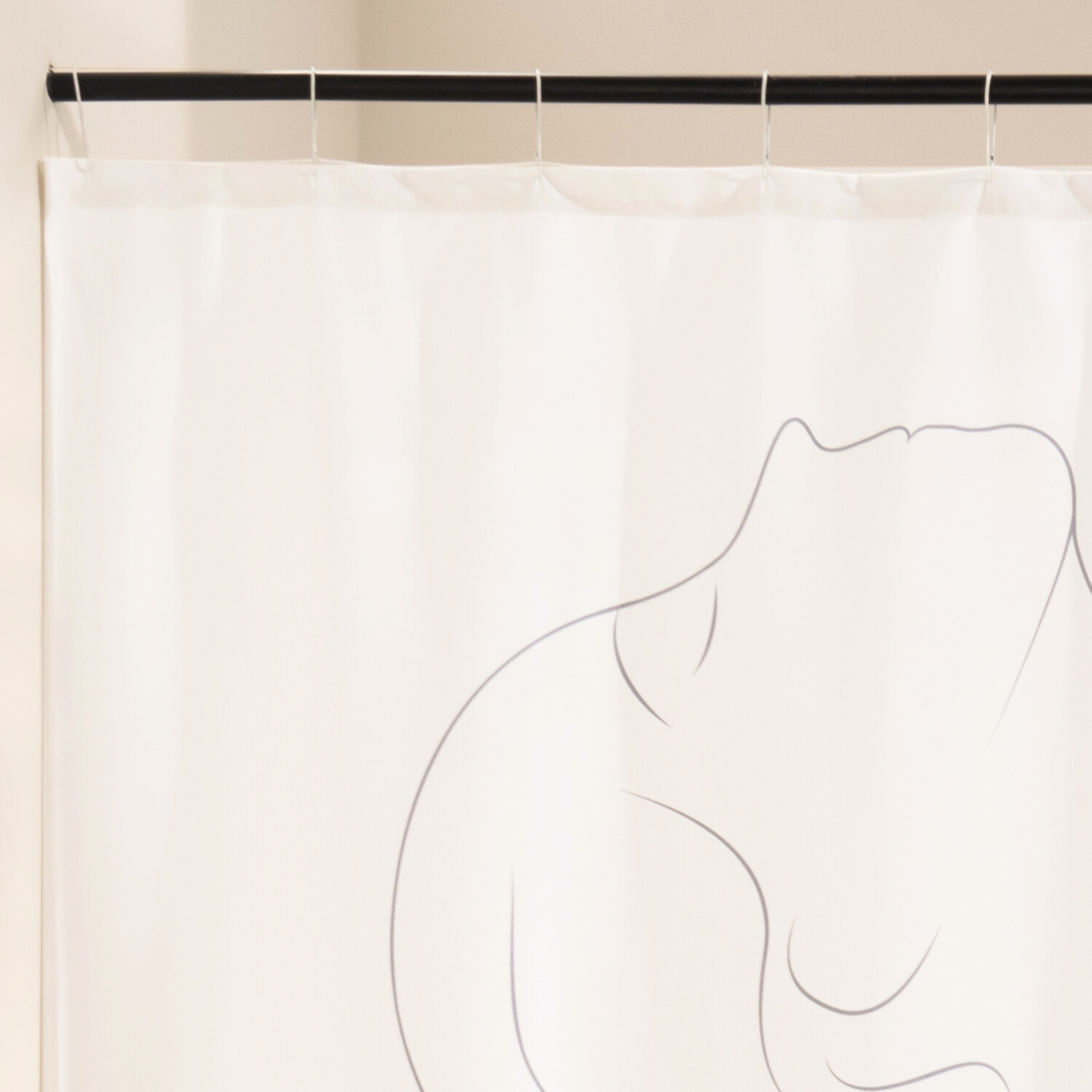 Close detail of the grey line drawing on the bare white cloth