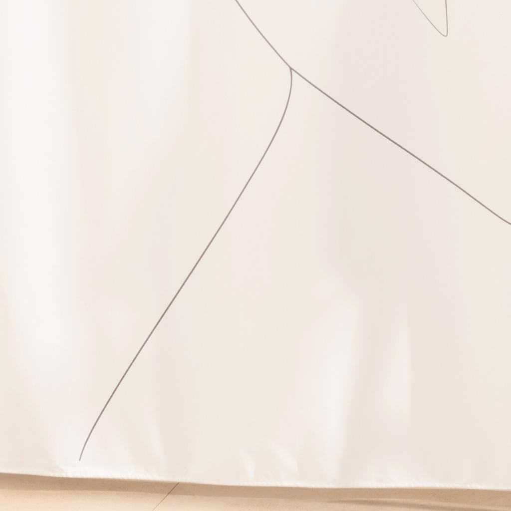 Full length line figure curtain hanging beside a glass screen
