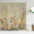 Blue birds perched on blossoming chinoiserie branches over a sage taupe ground