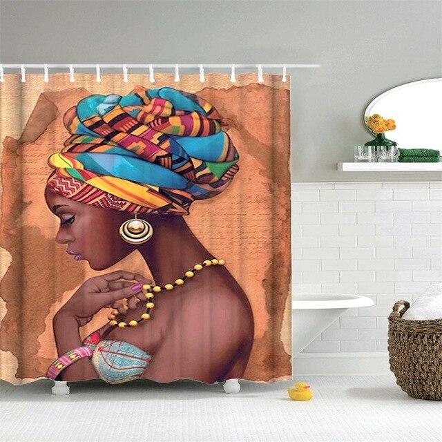 Profile portrait of a Black woman in a colourful wax print turban and gold hoop