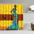 Woman in a turquoise patterned dress standing before a large rayed yellow sun