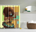 Young woman with an afro and wax print dress blowing a pink bubble