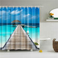 Bright turquoise lagoon with a pale wooden jetty running out to a stilt hut