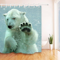 Polar bear pressing a paw against glass in turquoise water full of bubbles