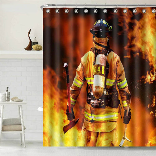 Firefighter from behind in yellow reflective kit and helmet before orange flames