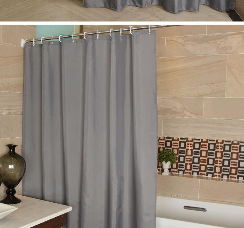 Close view of the untextured grey fabric and its regular pleats