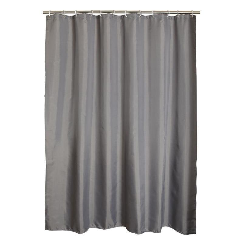 Grey panel shown hanging beside a bath in daylight
