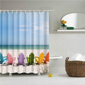 Row of multicoloured deck chairs on pale sand beside a turquoise sea
