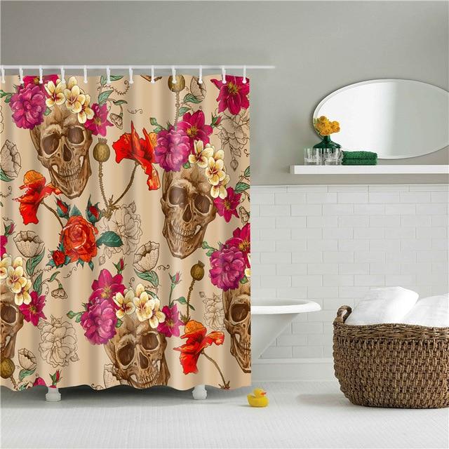 Bone coloured skulls ringed by fuchsia roses and red poppies on sandy beige