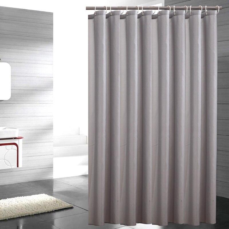 Plain grey woven curtain panel falling in soft natural textile folds