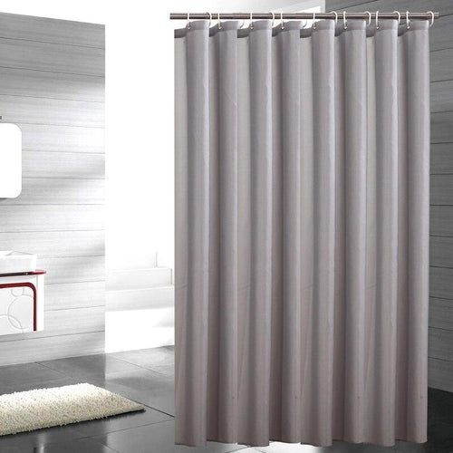 Plain grey woven curtain panel falling in soft natural textile folds