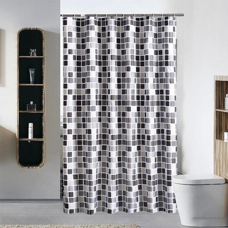 Even mosaic of black and grey squares repeating on a white ground