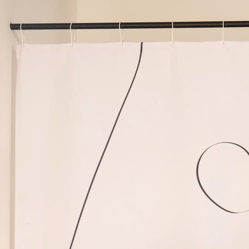 Close detail of the free looping line drawn across the cream cloth