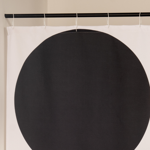 Close detail of the stacked black arcs on the ecru woven ground