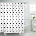 Solid black dots in an even staggered repeat printed edge to edge on white