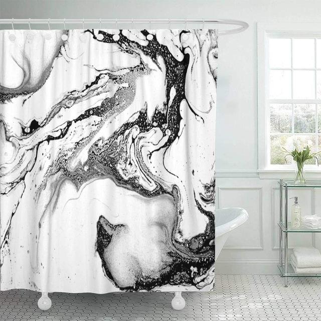 Black ink swirls marbling across white in whirls and fine filaments