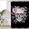 White skull ringed by drawn roses and pastel flowers on solid black