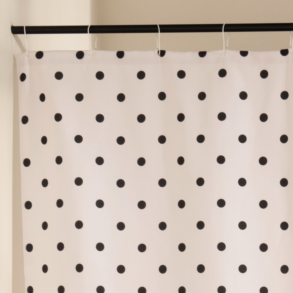 Close detail of the printed black dots on the beige woven cloth