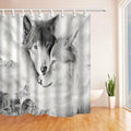 Two wolves drawn in graphite against a soft grey gradient background