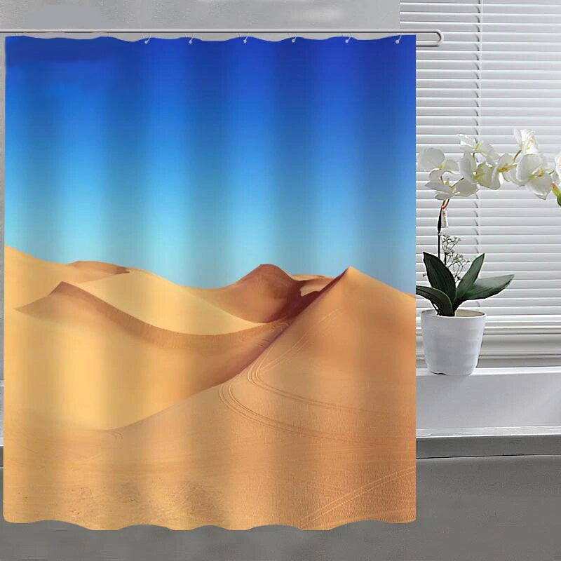 Clear sky blue upper half meeting golden brown sand dunes below