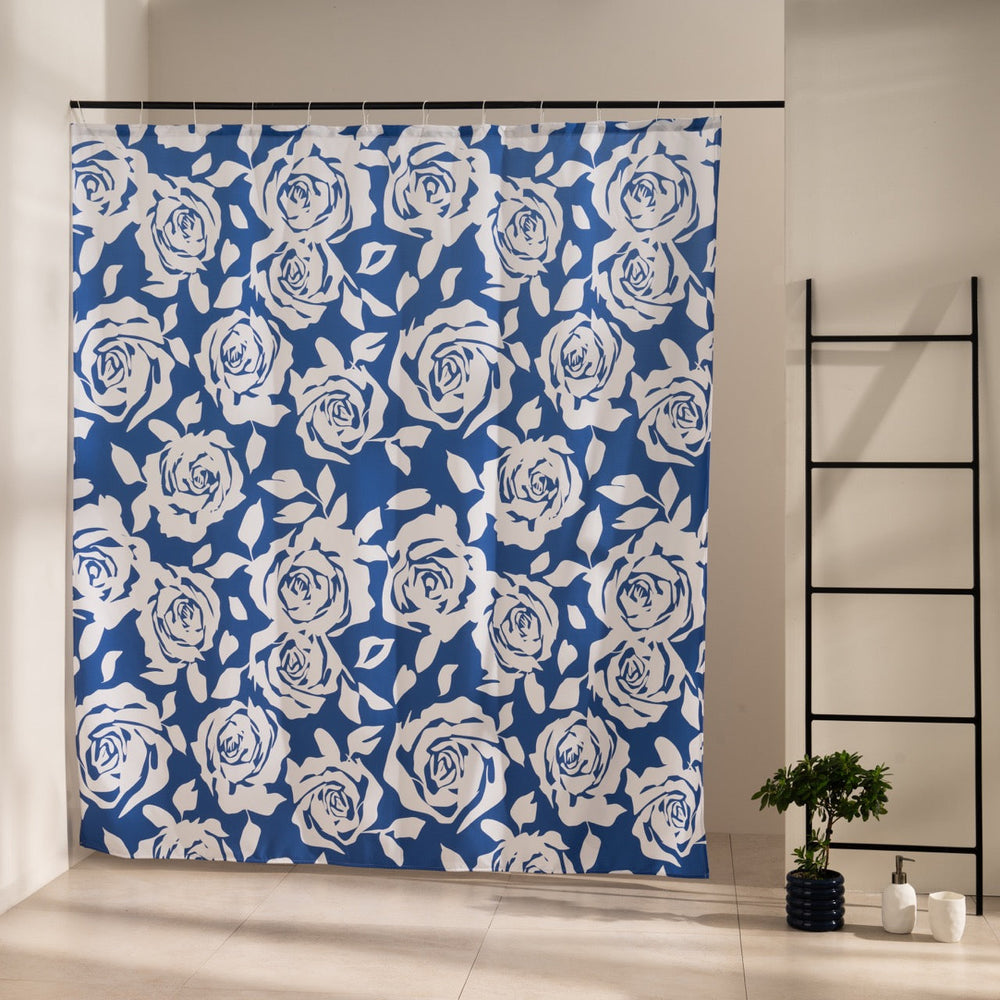 Cream roses and foliage drawn all over a dense navy blue ground