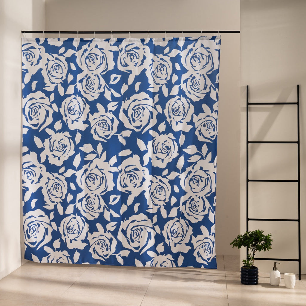 Cream roses and foliage drawn all over a dense navy blue ground