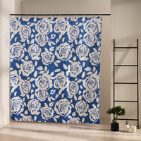 Cream roses and foliage drawn all over a dense navy blue ground