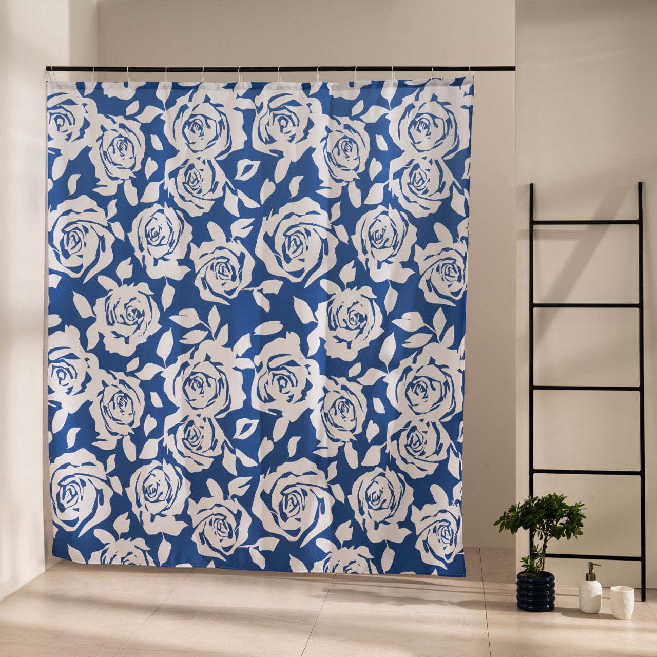 Cream roses and foliage drawn all over a dense navy blue ground