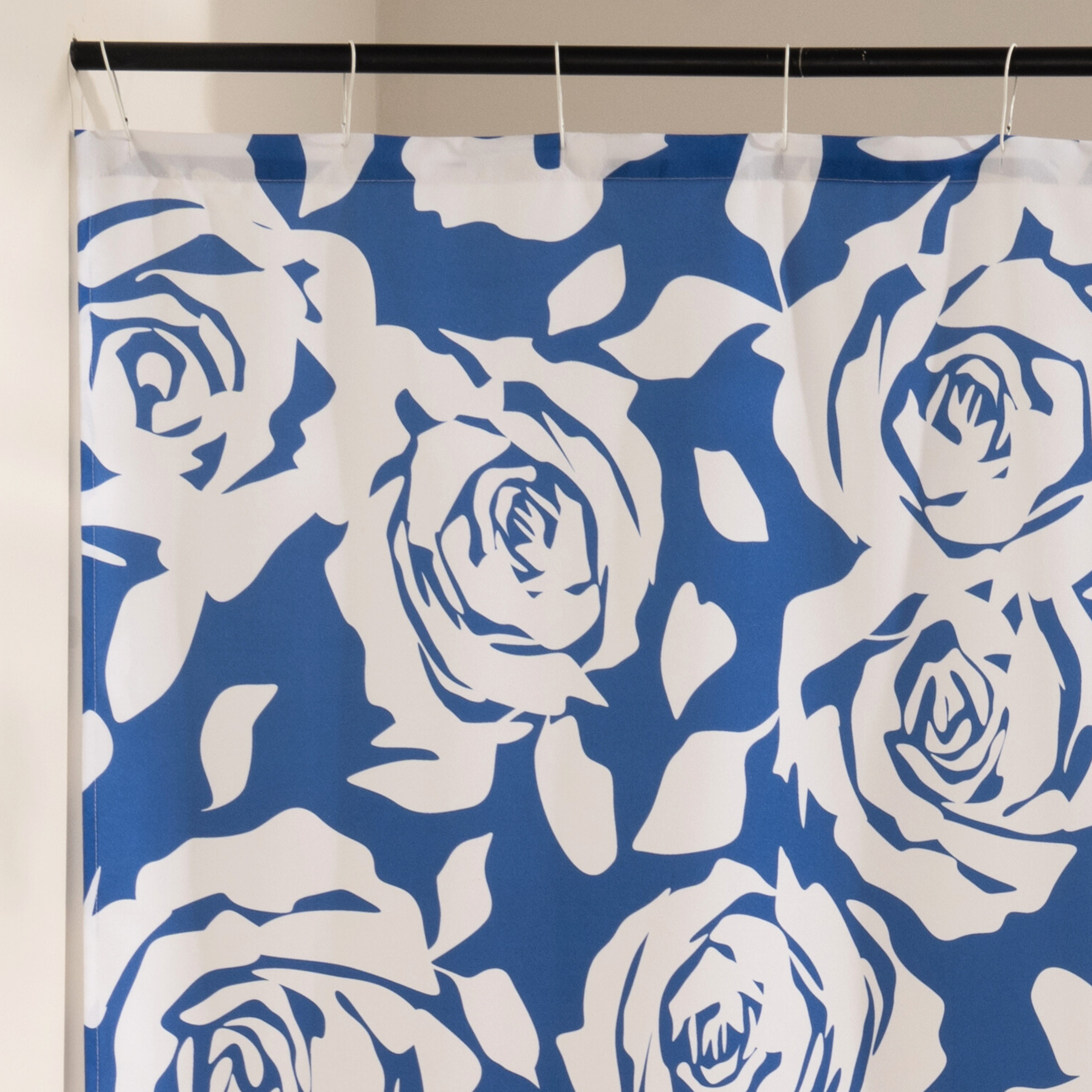 Close detail of the cream rose outlines against the deep navy