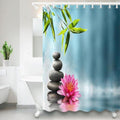 Bright bamboo leaves above stacked black pebbles and a pink lotus on turquoise