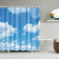 Blue sky with large white cumulus clouds printed across a fabric shower curtain
