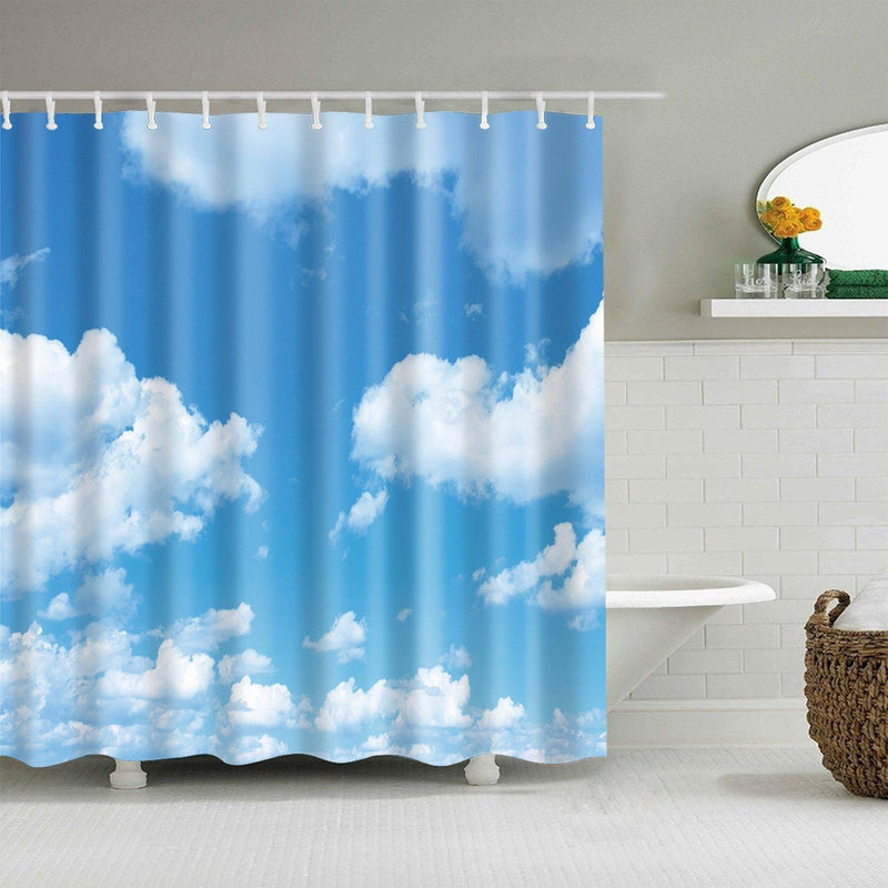 Blue sky with large white cumulus clouds printed across a fabric shower curtain