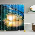Curling blue turquoise wave with a golden yellow sun setting inside the barrel