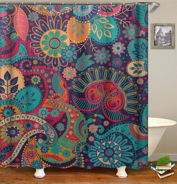 Turquoise pink and orange paisleys and rosettes covering a midnight blue ground