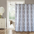 Thick white ogee trellis drawn across a pale blue-grey curtain ground