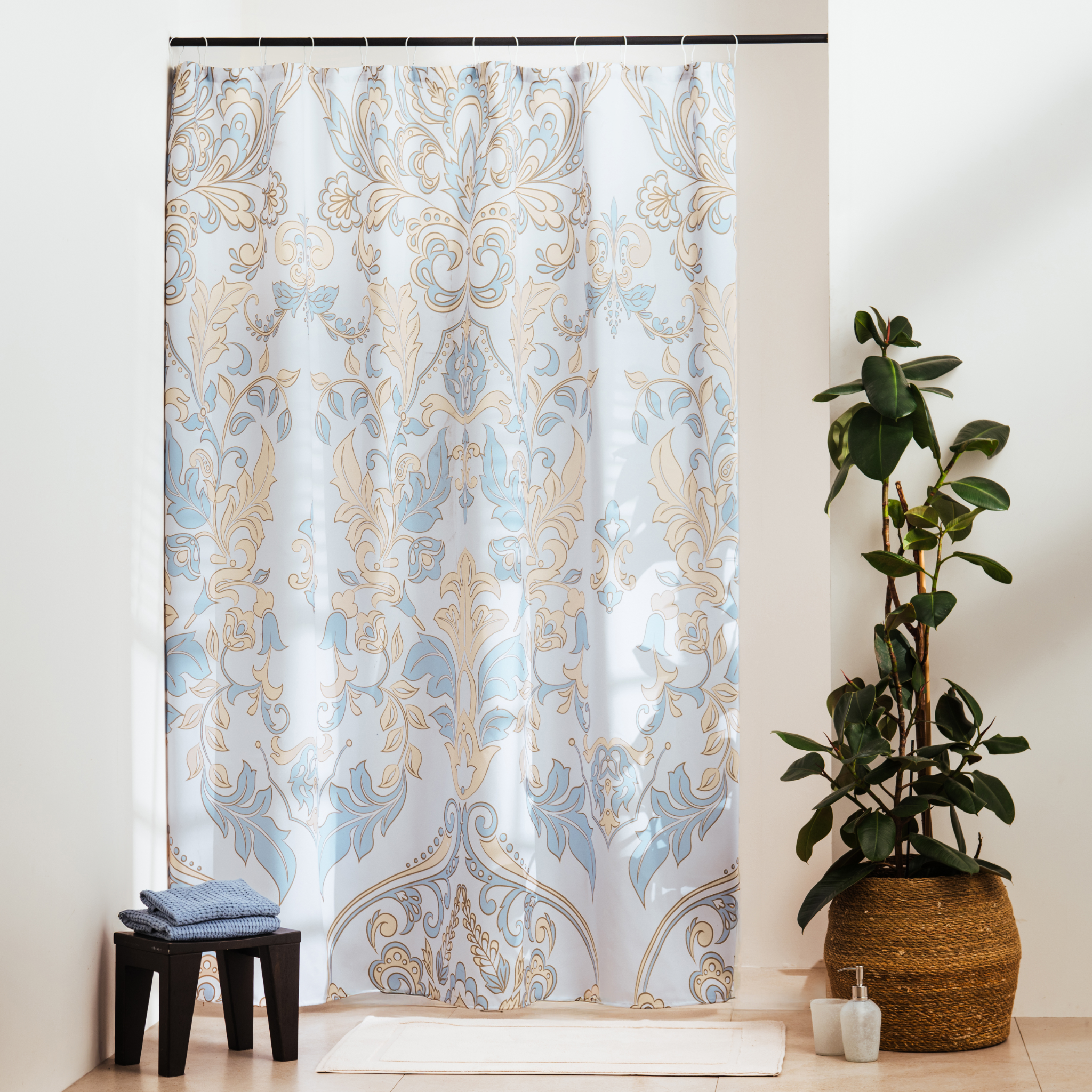 Light blue baroque scrolls and paisley drawn densely on off-white