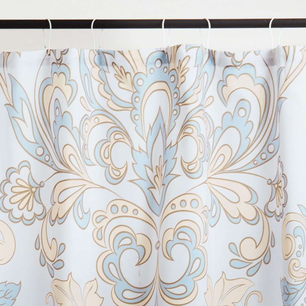 Close detail of the blue scrollwork on the matte pleated fabric
