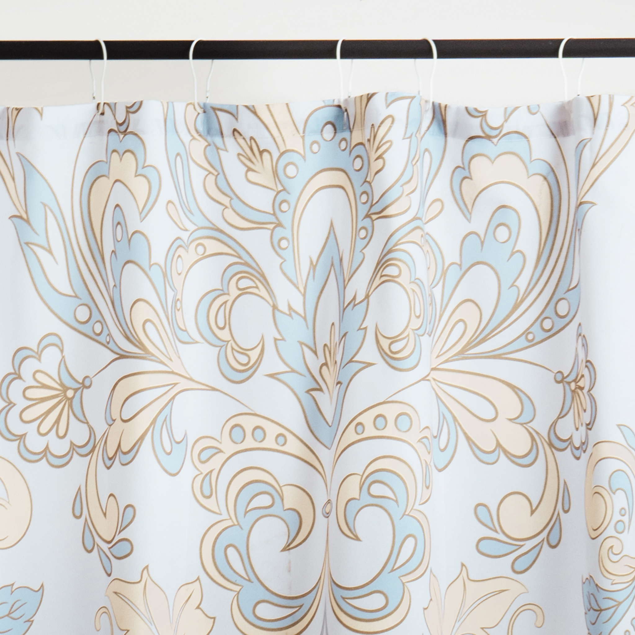 Close detail of the blue scrollwork on the matte pleated fabric