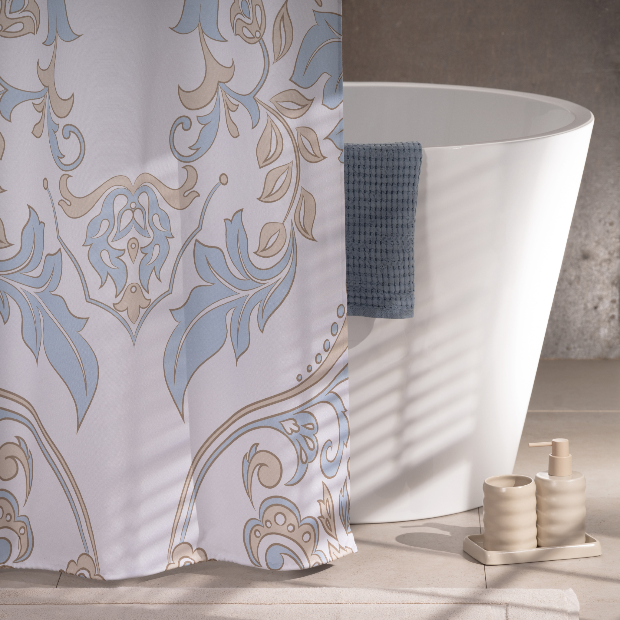 Blue toile curtain styled in a classic bathroom with warm daylight