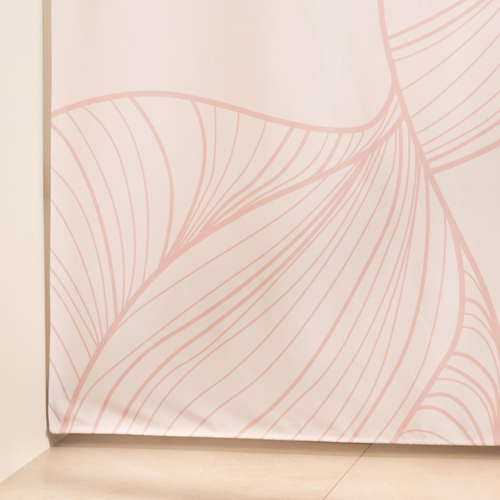 Full length blush line curtain hanging beside a glass shower screen