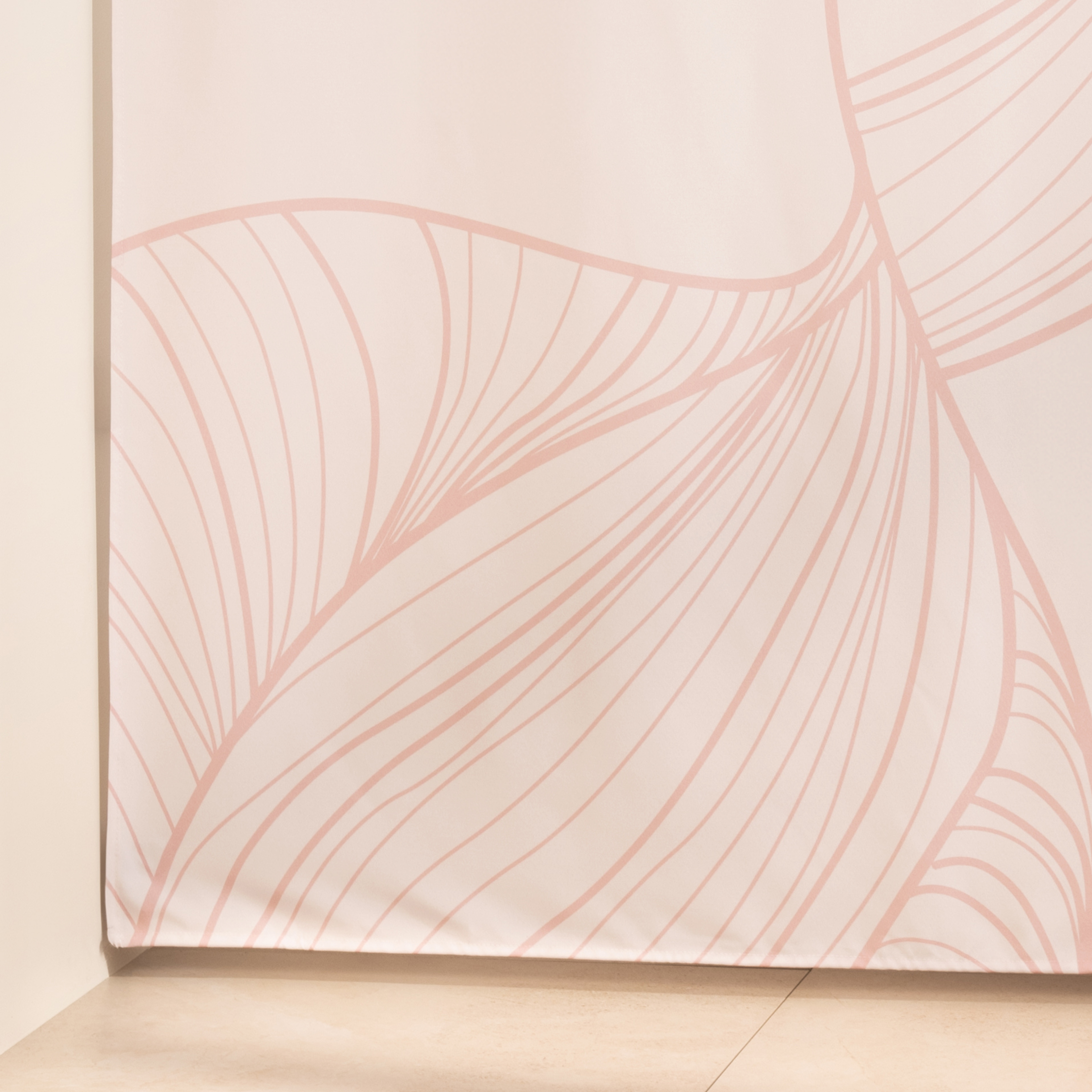 Full length blush line curtain hanging beside a glass shower screen