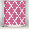 Regular white quatrefoil trellis printed over an even raspberry pink ground