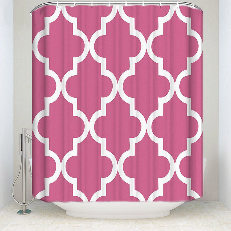 Regular white quatrefoil trellis printed over an even raspberry pink ground